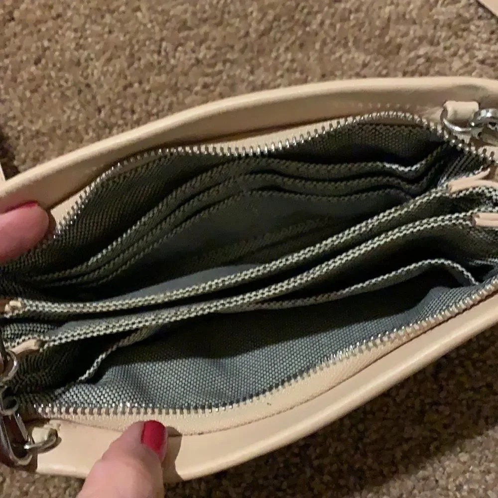 Vince Camuto soft pink crossbody wristlet.